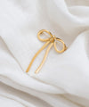 Metal ribbon brooch