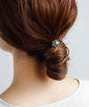 ゴールドフレームの艶めきヘキサゴンプレートのヘアゴム