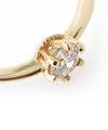 Twisted line single diamond ring