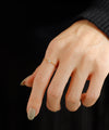 Twisted line single diamond ring