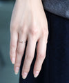 Twisted line single diamond ring