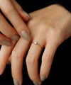 Twisted line single diamond ring