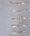 Twisted line single diamond ring