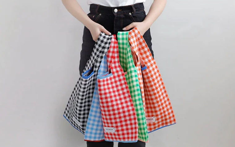 Introducing a new gingham check pattern in our designer knit bags! 