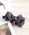 Piping volume ribbon banana clip