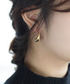 Curved drop hoop earrings